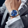 OLEVS Watches For Men Classic Blue Dial Mens Watches Day Date Mens Watches Sliver Stainless Steel Strap Watches Analog Quartz Watches Waterproof Watches Men Roman Numerals Watches Relojes Para Hombre