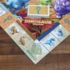 Hasbro Gaming Monopoly Junior Dinosaur Edition Board Game, 2-4 Players, with Dino-Themed Toy Tokens, Kids Easter Basket Stuffers, Ages 5+ (Amazon Exclusive)